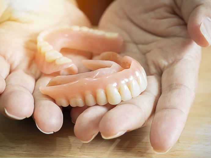 How do dental implants different from dentures