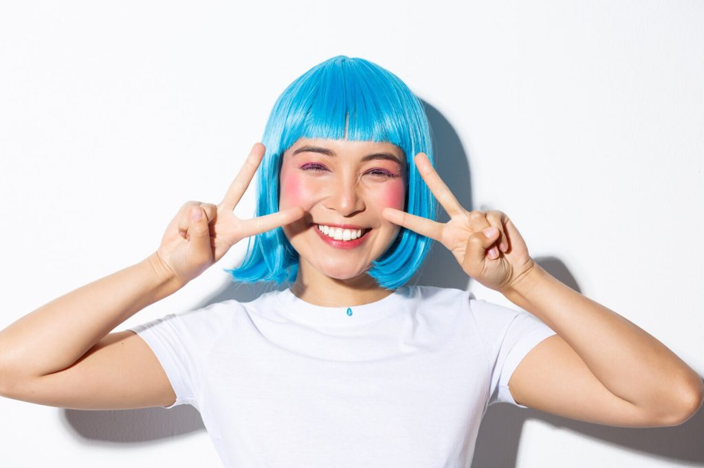 image cute asian woman blue wig showing kawaii peace gesture smiling 1258 18736